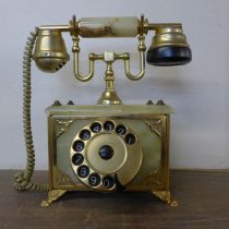 A vintage onyx and brass telephone