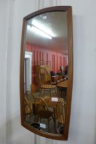 A teak framed mirror