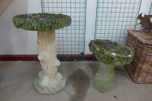 Two concrete garden bird baths