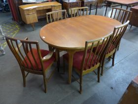 A McIntosh teak oval extending dining table and six chairs