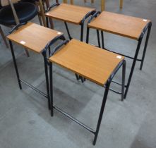 A set of four teak and and black tubular steel stools