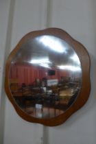 A teak framed mirror