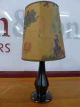 A 1950s brown porcelain table lamp, with original shade