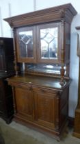 A 19th Century French Henry II style oak side cabinet