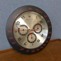 A Rolex style dealer's display wall clock