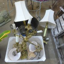 A gilt Rococo style table lamp on an onyx base and a pair of brass table lamps