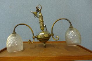 An Art Deco style brass three branch chandelier