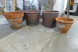 Four terracotta garden planters