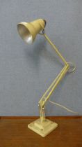 A Herbert & Terry & Sons Ltd. cream metal anglepoise desk lamp