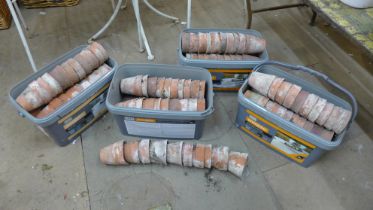 A large quantity of small terracotta plant pots, approx. 200