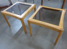 A pair of Ercol Blonde glass topped ash coffee tables