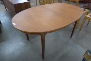 A McIntosh teak oval extending dining table