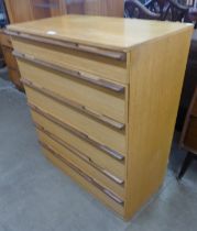 A teak chest of drawers