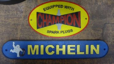 Two painted cast iron advertising signs, Michelin and Champion