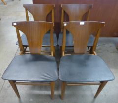 A set of four teak dining chairs