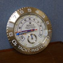 A Rolex style dealer's display wall clock