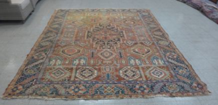 An eastern terracotta ground rug, 350 x 270cms