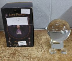 A Lisa Parker 100mm mystical crystal ball, boxed