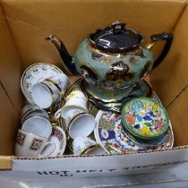 A Victorian black and green teapot and stand, two Egyptian themed plates, a pair of Argyle