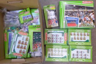 A collection of Subbuteo sets and a stadium, accessories and teams including Queens Park Rangers and