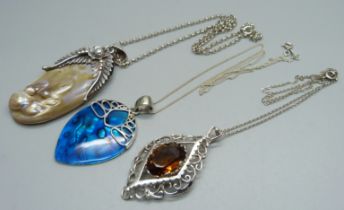A 925 silver and mother of pearl pendant and chain and two other pendants on silver chains, (test as