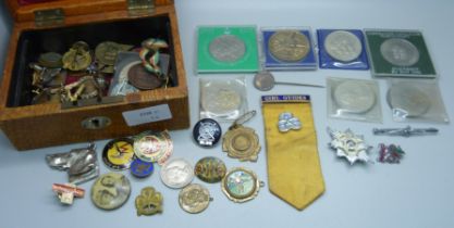 A leather jewellery box containing coins, medallions, badges, etc., (replica 8 Reales coin)