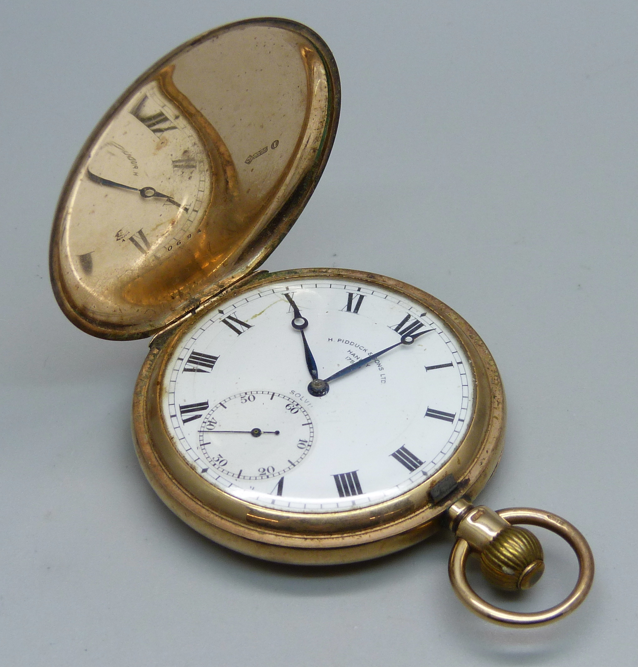 A 9ct gold full-hunter pocket watch, inner case 9ct gold, bears inscription dated 1928 and monogram,