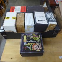 A box of Super 8 film reels, That's Entertainment, An American in Paris, Singin' In The Rain,