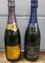 A bottle of Taittinger Champagne Prélude and a bottle of Veuve Cliquot Ponsardin Champagne 1998 **