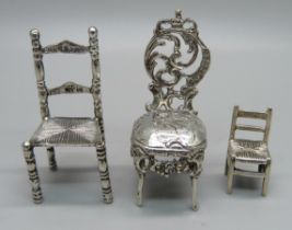 Two miniature silver model chairs with London import marks, 1897 and 1902, and a smaller 925