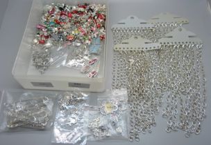 A collection of forty bracelets and a large collection of novelty charms