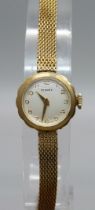 A lady's 9ct gold wristwatch, case back bears inscription, total weight 14.8g