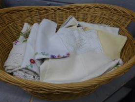A wicker basket containing a collection of embroidered linen **PLEASE NOTE THIS LOT IS NOT