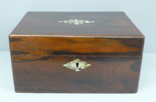 A Victorian rosewood workbox with mother of pearl marquetry inlay