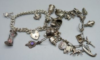 A silver charm bracelet, 36g, and a white metal charm bracelet, 54g