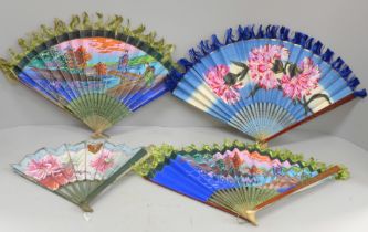 A collection of fans including one dated 1911 Coronation of King George V and Queen Mary