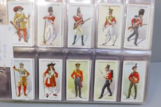 Cigarette cards; an album of twelve complete sets of cigarette cards including Players Regimental