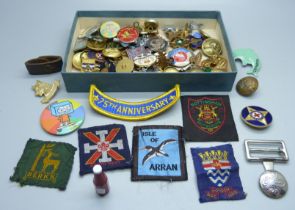 A collection of badges, buttons, etc.