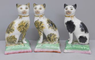Three small Victorian Staffordshire cats (2+1), 10cm
