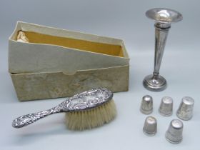 A silver posy vase, five silver thimbles and a small silver backed brush