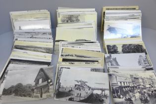 A large collection of over 400 original real photo postcards covering many topographical themes from