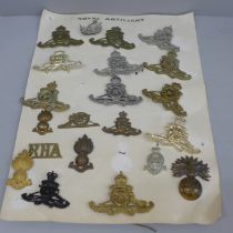 A collection of Royal Artillery cap badges