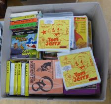 A box of Walton Super 8 films, mainly Tom and Jerry cartoons, approximately 40