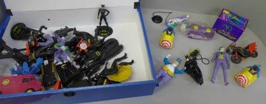Batman collection including plastic figures, die-cast models, key rings, etc.