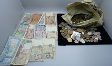 A collection of foreign coins and banknotes