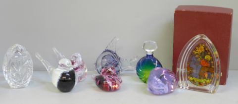 A Wedgwood 1984 Christmas glass paperweight, six other glass paperweights and a scent bottle