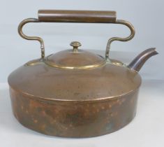 A Victorian large flat bottomed copper kettle