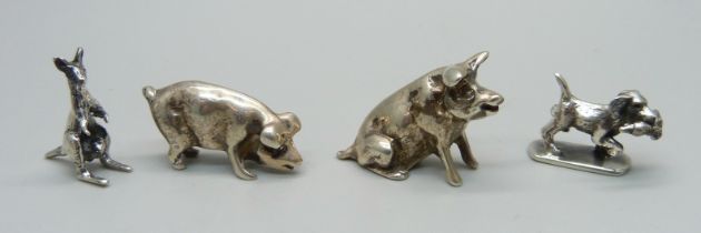 Four miniature silver animals; two pigs, a dog and a kangaroo