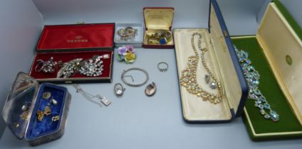 A collection of costume jewellery including a silver cocktail wristwatch head, and a plated box