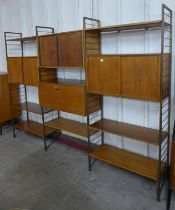 A Staples teak and gold metal three bay Ladderax room divider